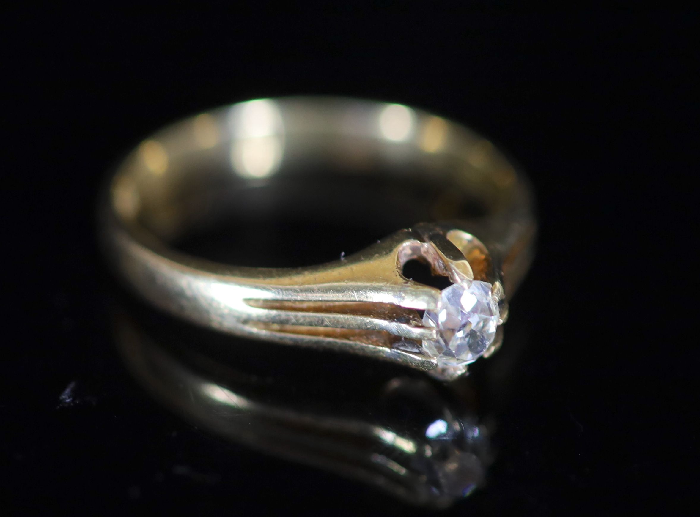 A mid 20th century 18ct gold and claw set oval cut solitaire diamond ring